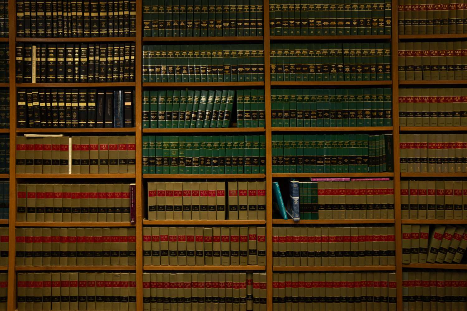 LGX-ESLAW_2025-05-21_014 book shelf full of old law books with a couple missing suggesing they were actually consulted